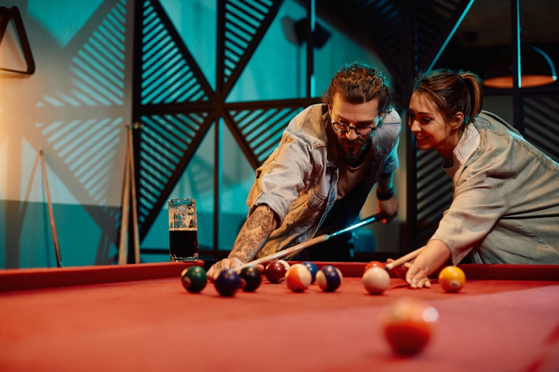 Professional pool table with green cloth and billiard balls