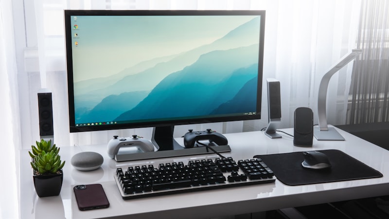 Desktop computer workstation with monitor, keyboard and mouse